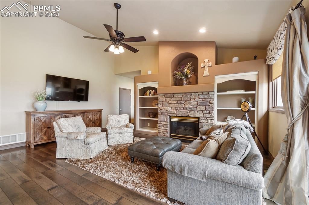 14525 Sterling Road Colorado Springs, CO 80921 - Photo 11 of 46 a living room with furniture and a fireplace