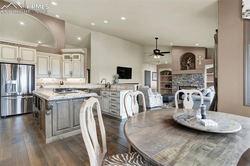 14525 Sterling Road Colorado Springs, CO 80921 - Photo 16 of 46 a kitchen with stainless steel appliances granite countertop a sink stove and refrigerator