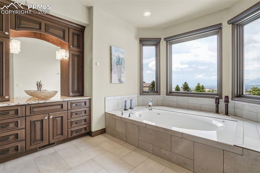 14525 Sterling Road Colorado Springs, CO 80921 - Photo 25 of 46 a spacious bathroom with a large tub and sink