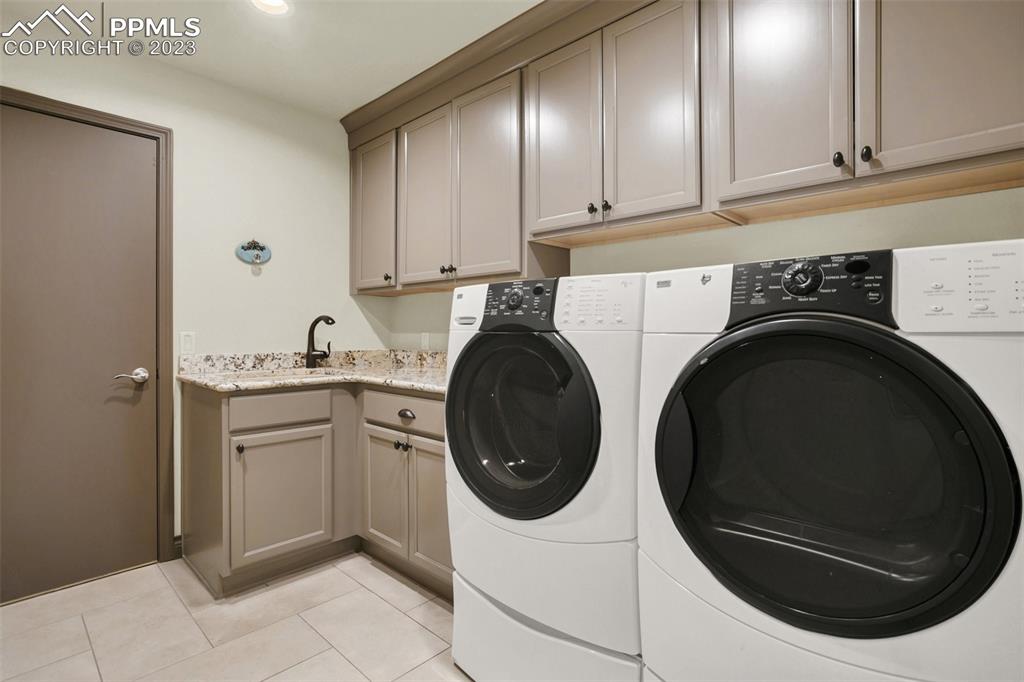 14525 Sterling Road Colorado Springs, CO 80921 - Photo 33 of 46 a utility room with sink dryer and washer