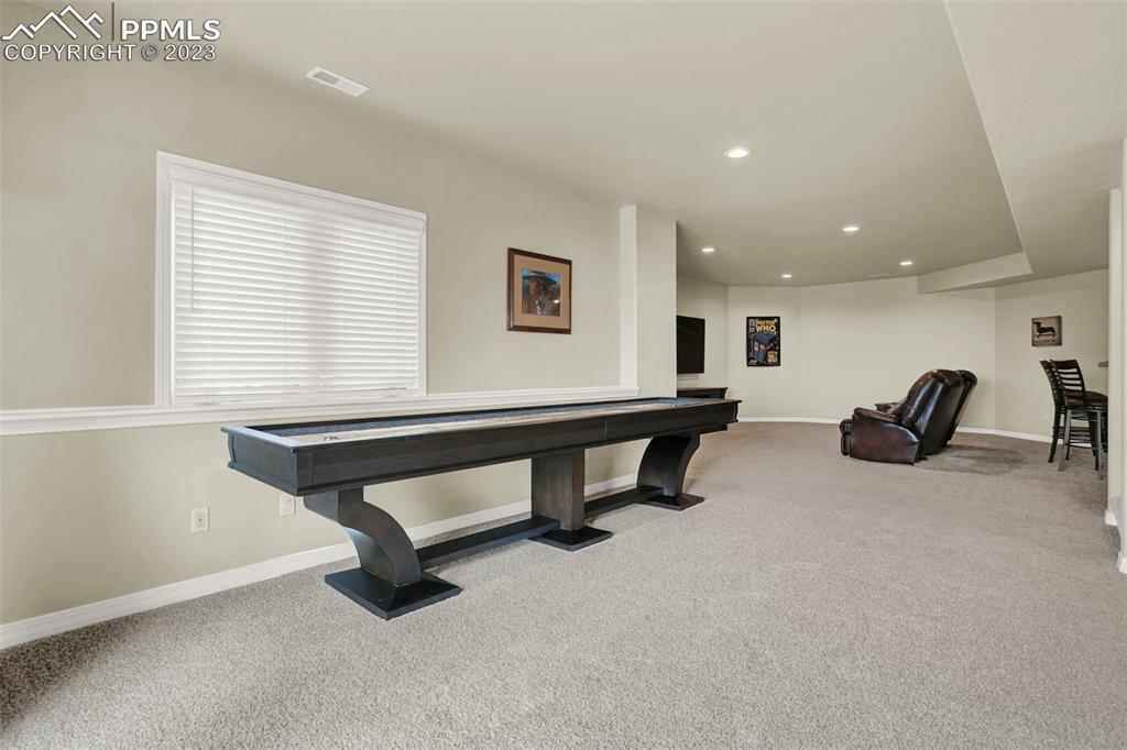 14525 Sterling Road Colorado Springs, CO 80921 - Photo 34 of 46 a room with furniture and a window