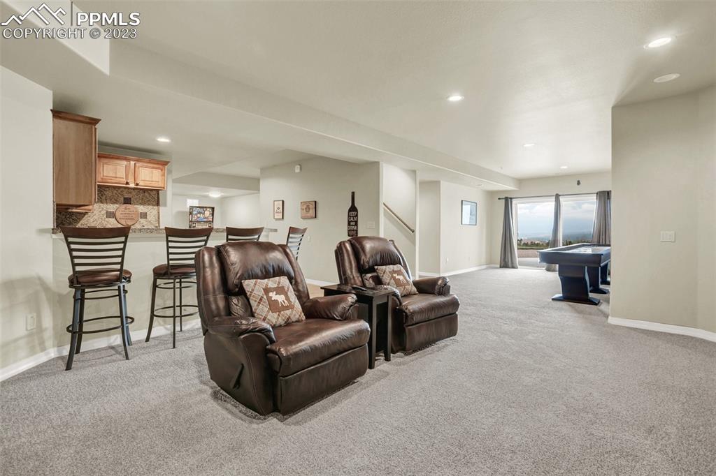 14525 Sterling Road Colorado Springs, CO 80921 - Photo 35 of 46 a living room with furniture and a wooden floor