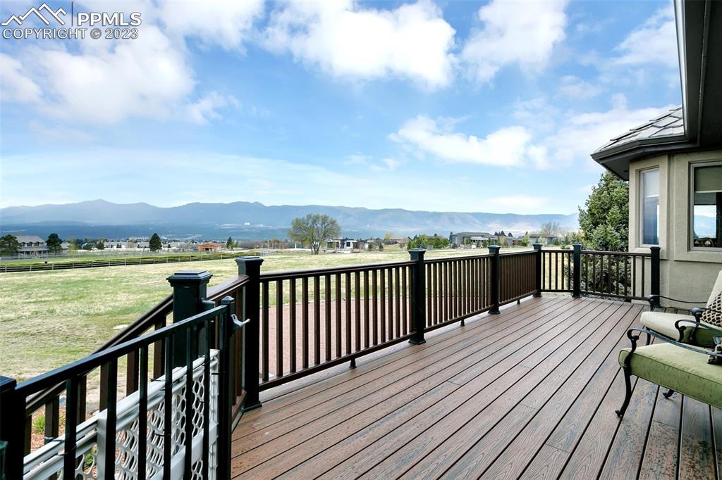 14525 Sterling Road Colorado Springs, CO 80921 - Photo 40 of 46 a view of a roof deck with wooden floor and fence next to a yard