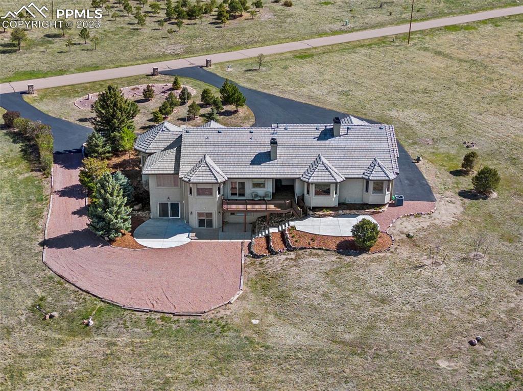 14525 Sterling Road Colorado Springs, CO 80921 - Photo 4 of 46 an aerial view of a house with garden space and sitting area