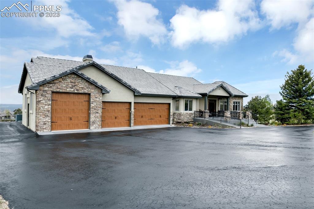 14525 Sterling Road Colorado Springs, CO 80921 - Photo 5 of 46 a front view of a house with yard