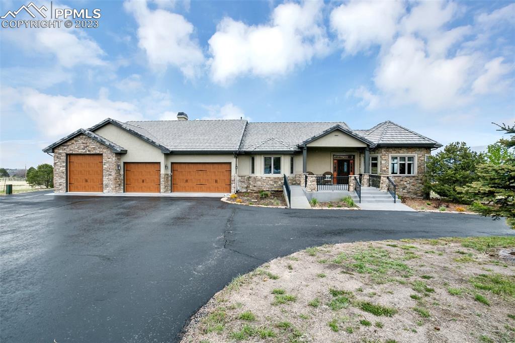 14525 Sterling Road Colorado Springs, CO 80921 - Photo 6 of 46 a front view of a house with garden