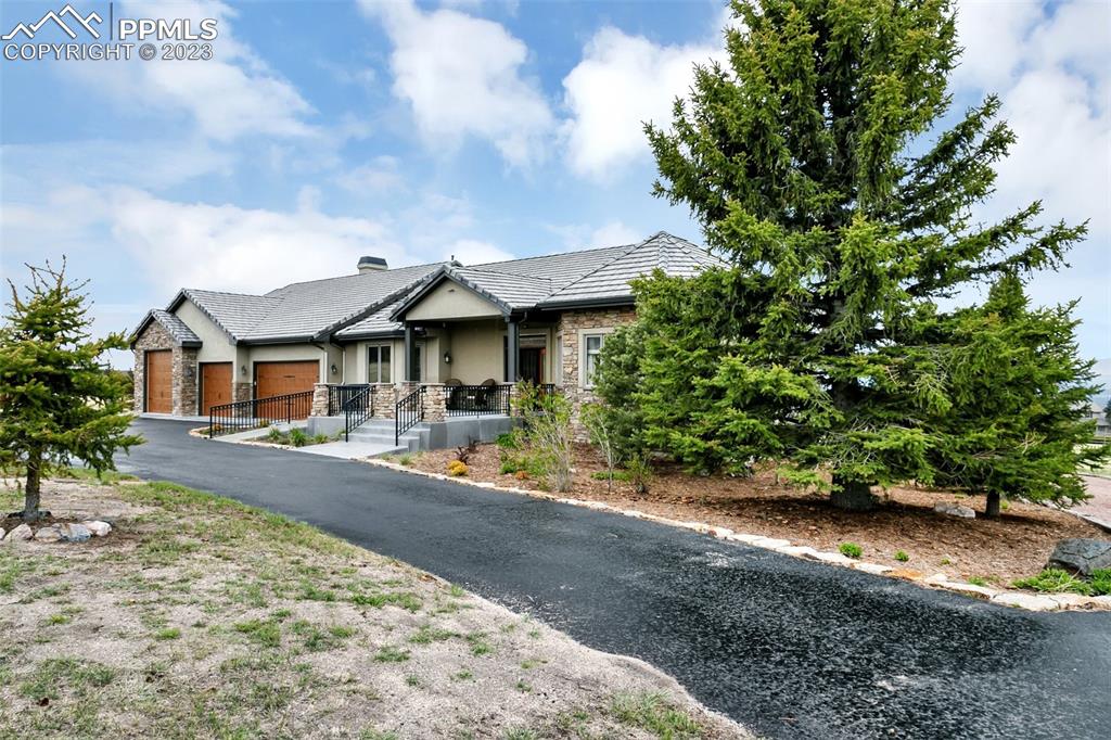 14525 Sterling Road Colorado Springs, CO 80921 - Photo 7 of 46 a front view of a house with yard porch and livingroom