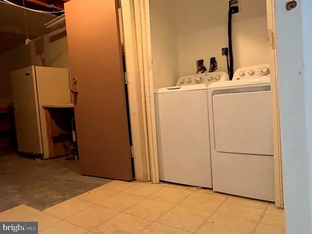 a view of an empty room with a fireplace