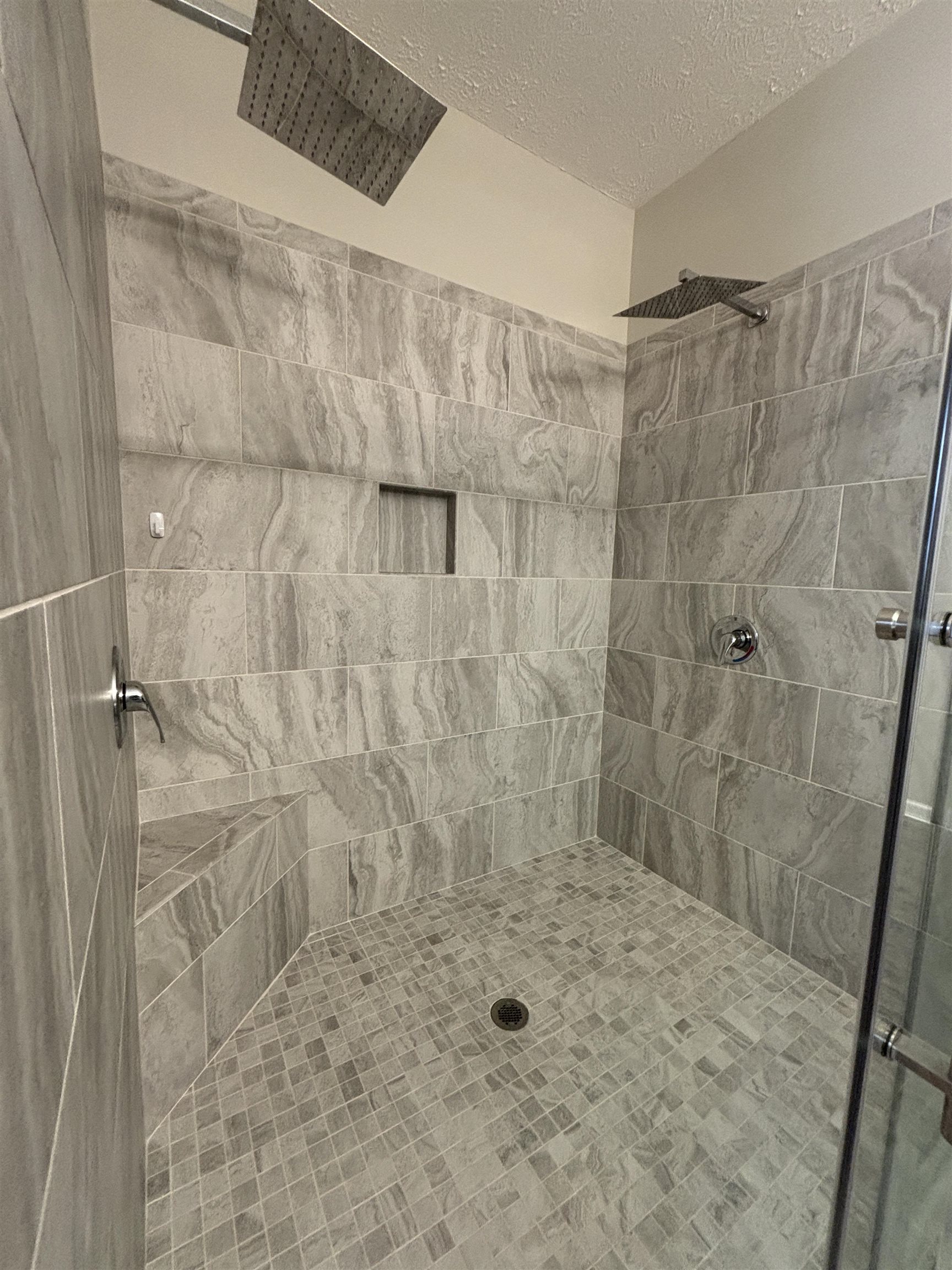 227 Leste Road Myrtle Beach, SC 29588 - Photo 29 of 33 Bathroom featuring a tile shower and a textured ceiling