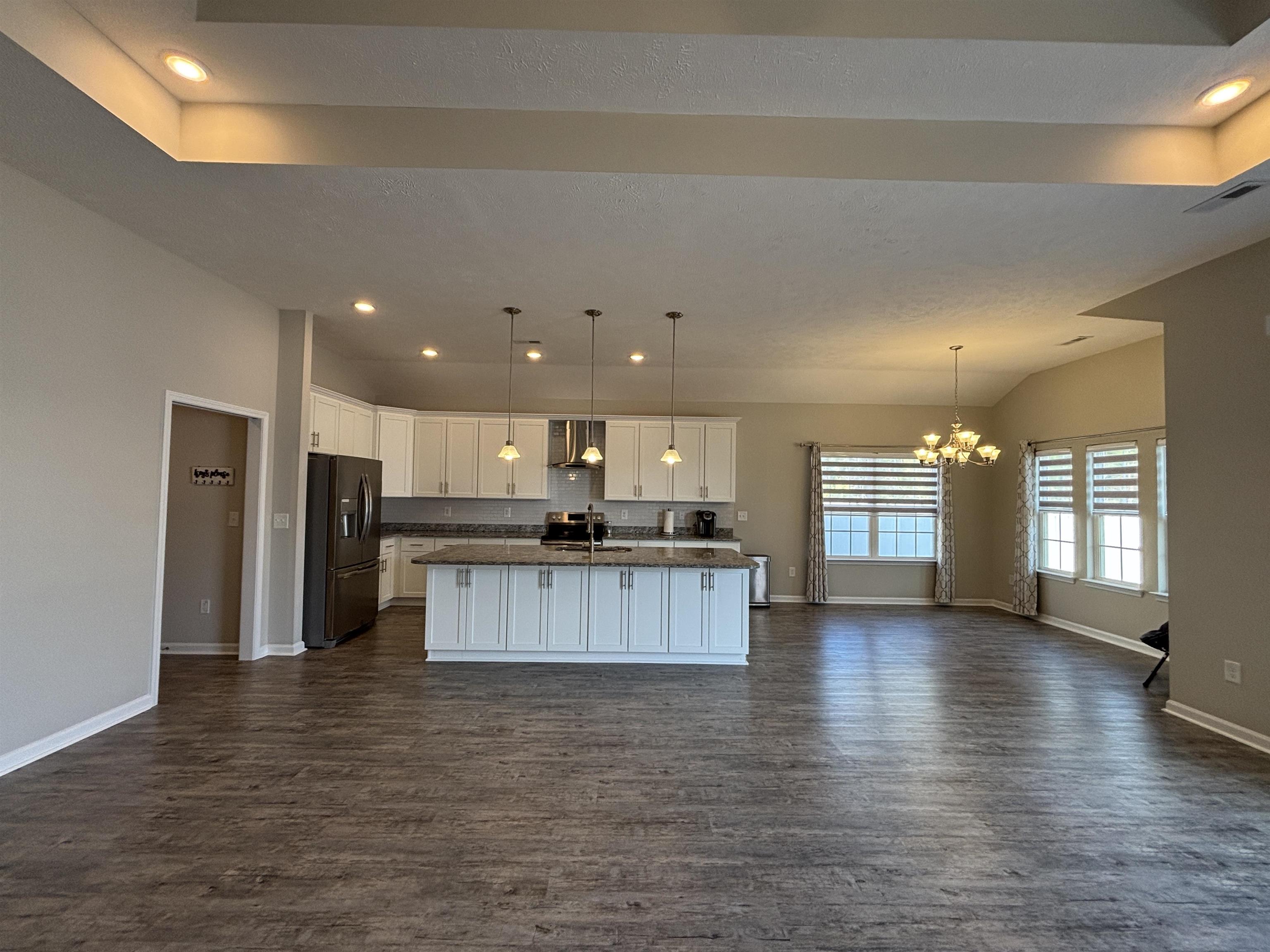 227 Leste Road Myrtle Beach, SC 29588 - Photo 31 of 33 Kitchen with white cabinetry, recessed lighting, open floor plan, black refrigerator with ice dispenser, and hanging light fixtures