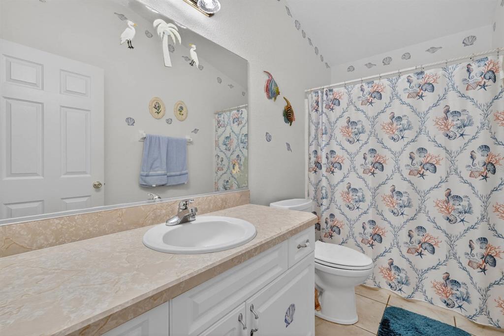 80 Roxboro Drive Palm Coast, FL 32164 - Photo 16 of 39 a bathroom with a sink toilet and shower