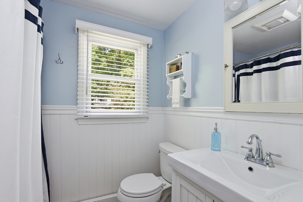 8 Emerald Way Sandwich, MA 02644 - Photo 22 of 36 a bathroom with a sink a toilet and a mirror
