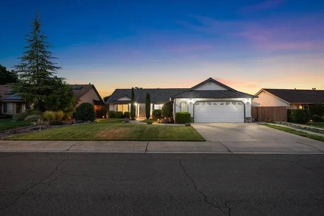 a front view of house with yard and outdoor seating