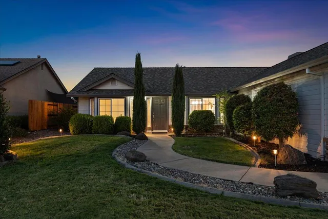 a bath tub sitting in a bathroom next to a window