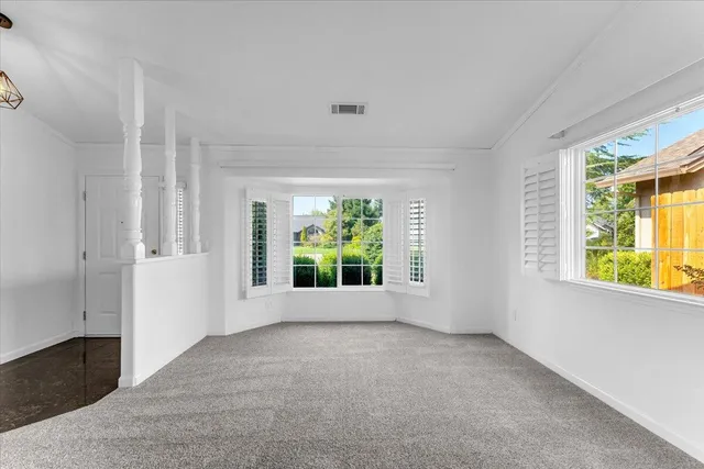 a view of a house with swimming pool and a yard