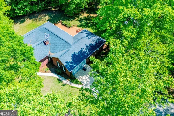 an aerial view of houses with yard