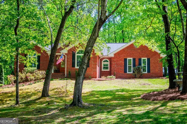 a front view of a house with yard