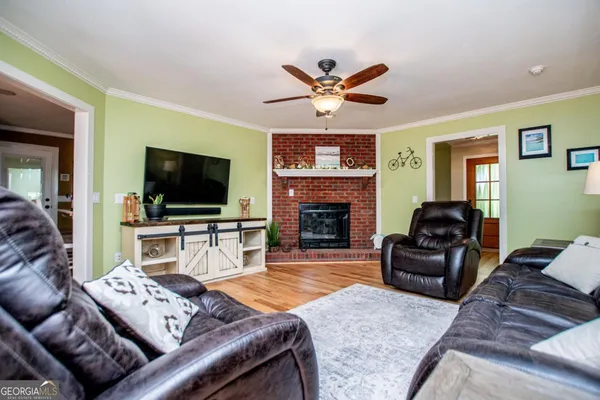 a kitchen with stainless steel appliances white cabinets and a stove top oven