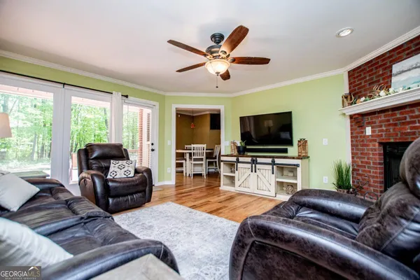 a kitchen with white cabinets and sink