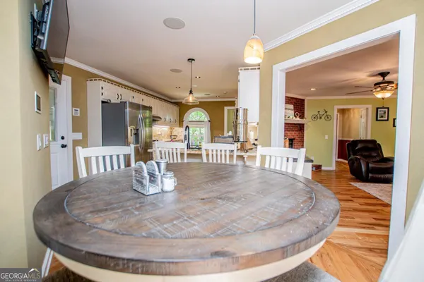a kitchen with cabinets a window and stainless steel appliances