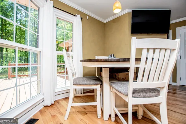 a large bed sitting in a bedroom next to a small yard