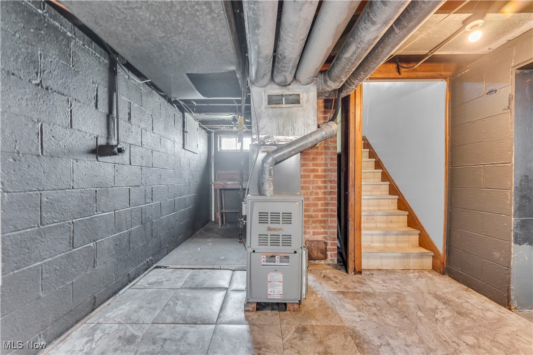 5817 Turney Road Garfield Heights, OH 44125 - Photo 27 of 31 Basement with stairs and heating unit