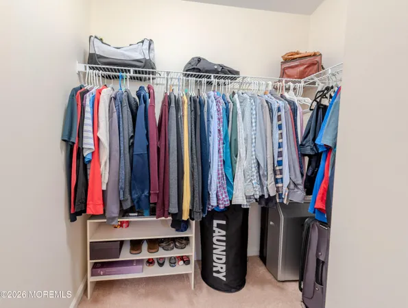 a bedroom with a bed and a mirror