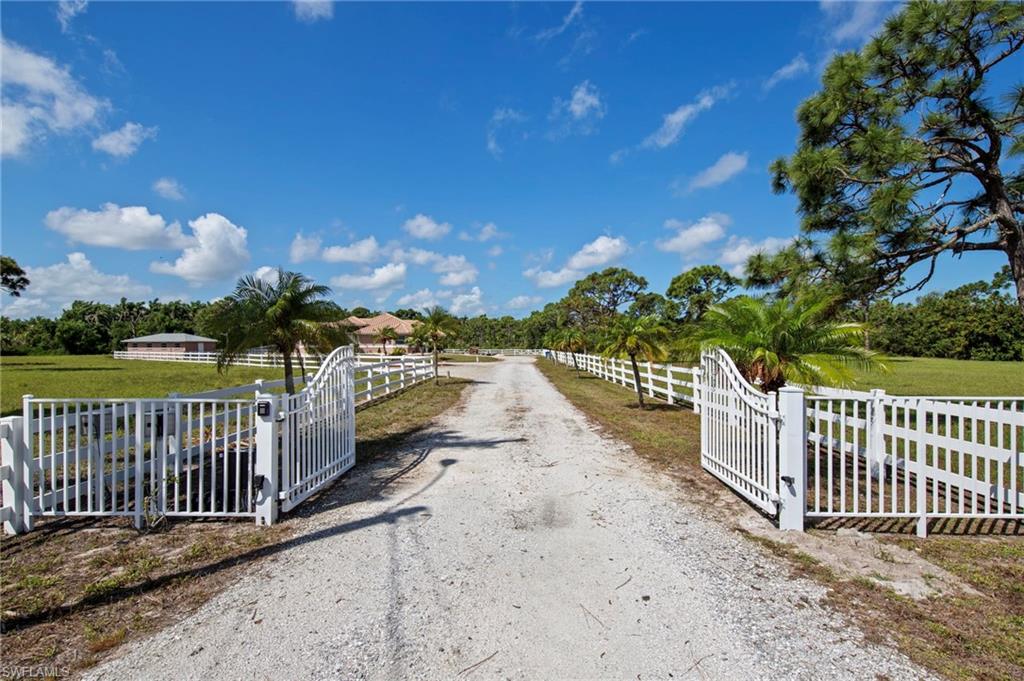 13541 Stringfellow Road Bokeelia, FL 33922 - Photo 2 of 49 a view of a wrought iron fences in front of house