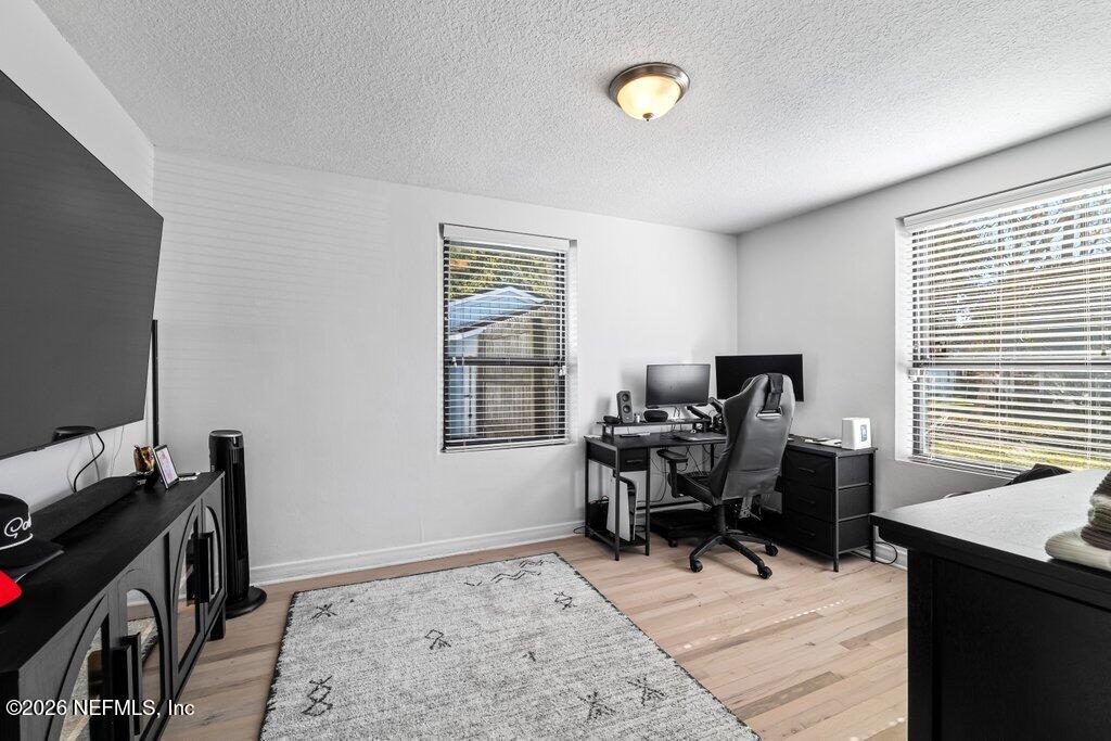 4145 Springwood Road Jacksonville, FL 32207 - Photo 21 of 33 a view of a workspace with furniture and a window