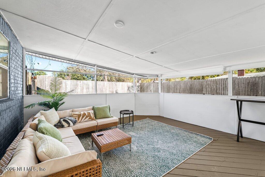 4145 Springwood Road Jacksonville, FL 32207 - Photo 25 of 33 a living room with furniture and a table