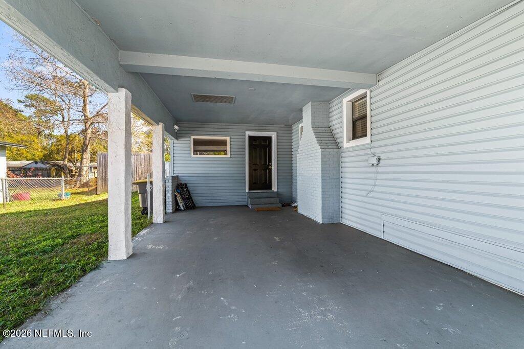 4145 Springwood Road Jacksonville, FL 32207 - Photo 26 of 33 a view of a porch with furniture and garden