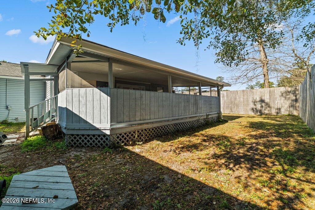 4145 Springwood Road Jacksonville, FL 32207 - Photo 27 of 33 a view of a house with a yard