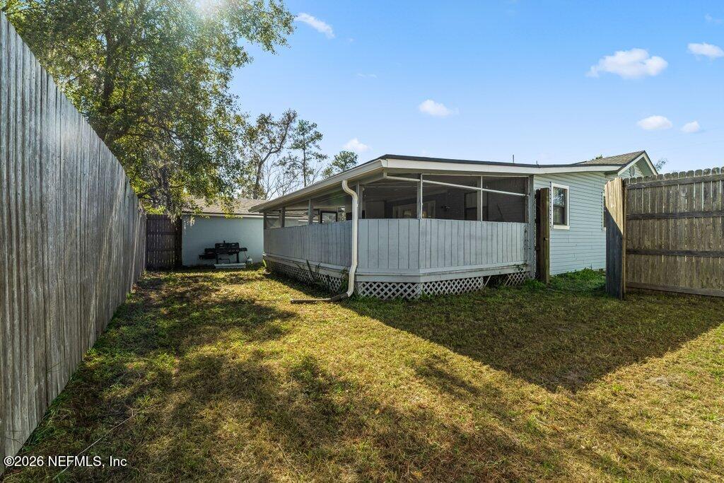4145 Springwood Road Jacksonville, FL 32207 - Photo 28 of 33 a front view of a house with a yard