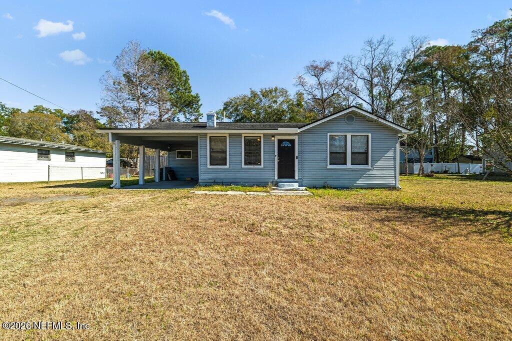 4145 Springwood Road Jacksonville, FL 32207 - Photo 32 of 33 a view of a house with a garden