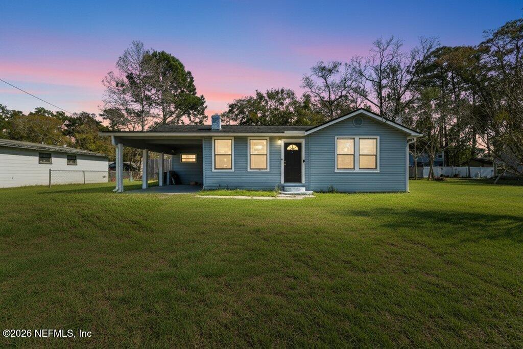 4145 Springwood Road Jacksonville, FL 32207 - Photo 33 of 33 a front view of a house with a garden