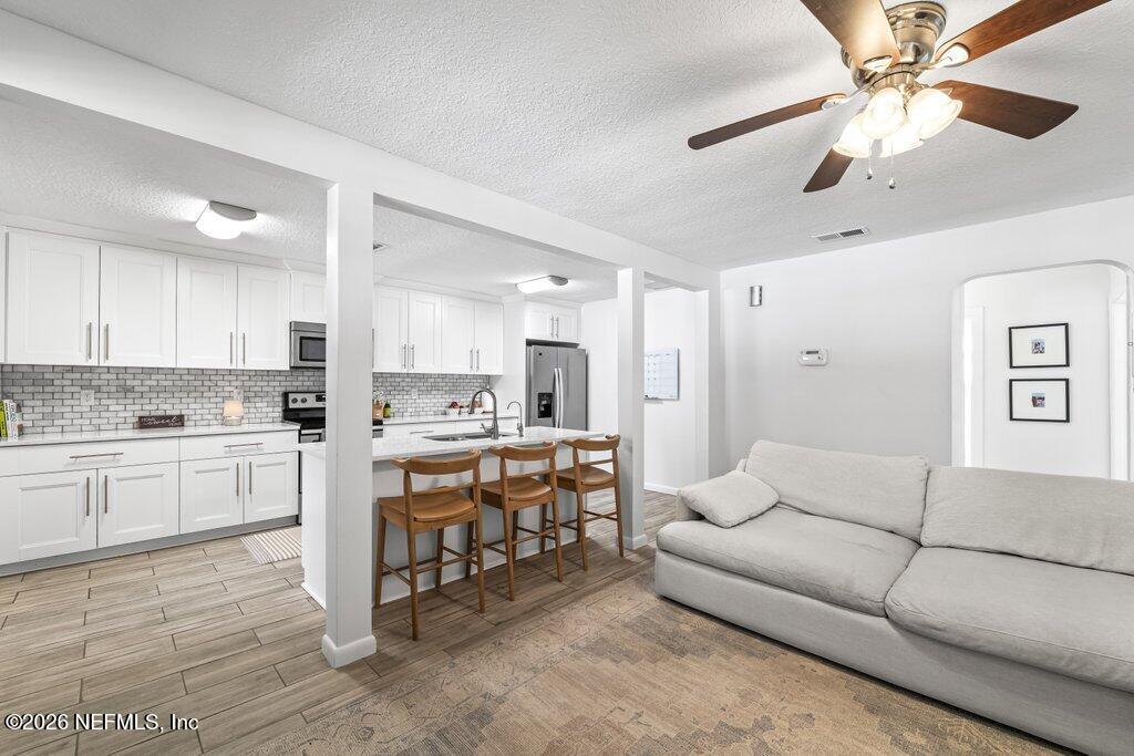 4145 Springwood Road Jacksonville, FL 32207 - Photo 8 of 33 a living room with furniture and view kitchen