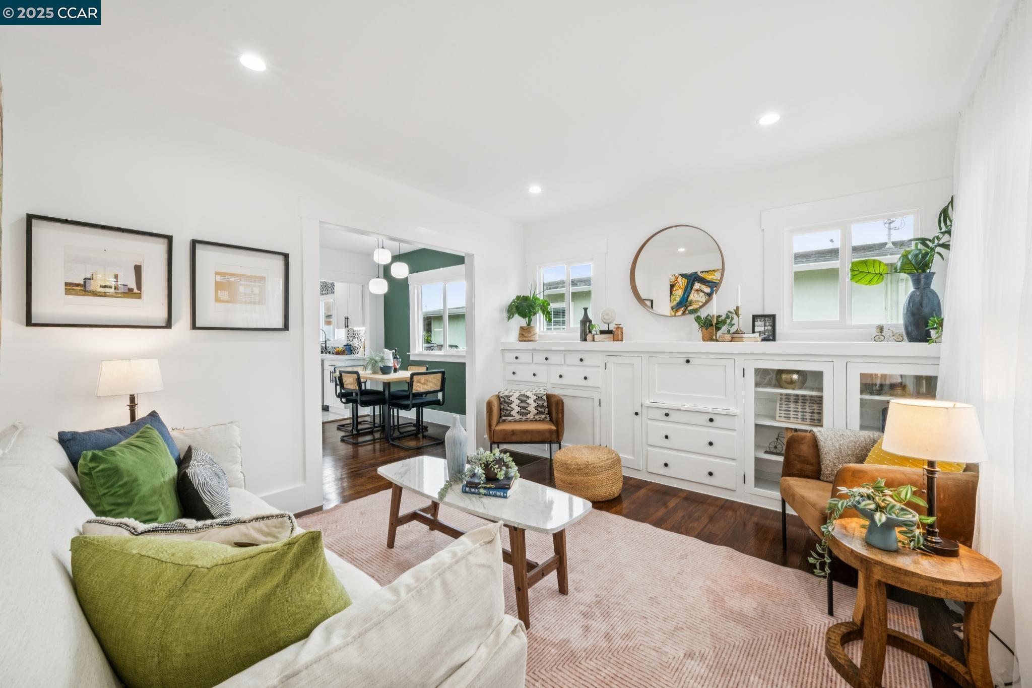 1128 60th Avenue Oakland, CA 94621 - Photo 2 of 7 a living room with furniture and a window