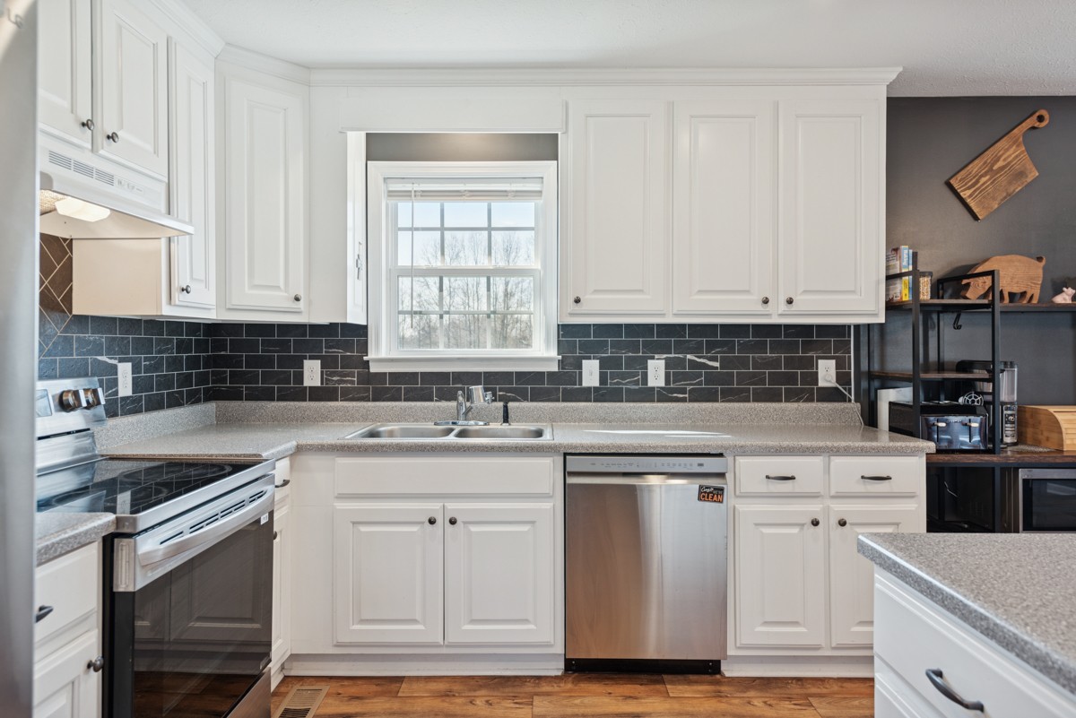 4915 Little Dry Creek Road Pulaski, TN 38478 - Photo 11 of 45 a kitchen with white cabinets sink and appliances