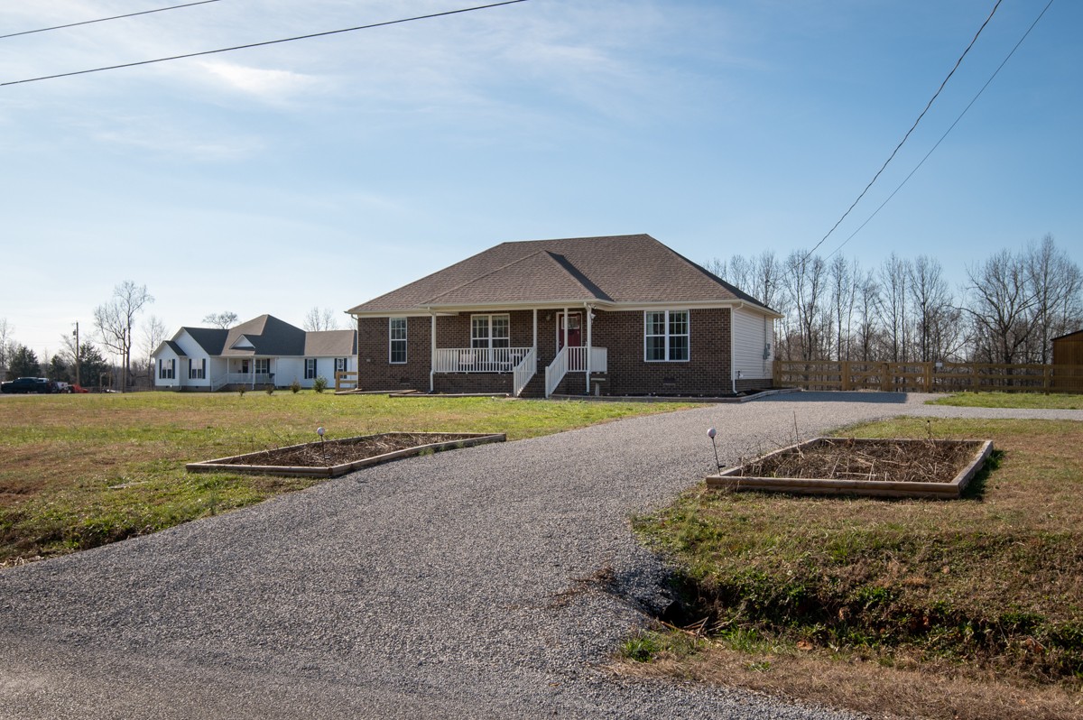 4915 Little Dry Creek Road Pulaski, TN 38478 - Photo 2 of 45 a front view of a house with a yard