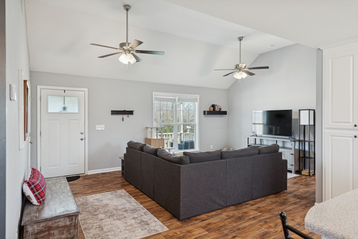 4915 Little Dry Creek Road Pulaski, TN 38478 - Photo 8 of 45 a living room with furniture a ceiling fan and a flat screen tv