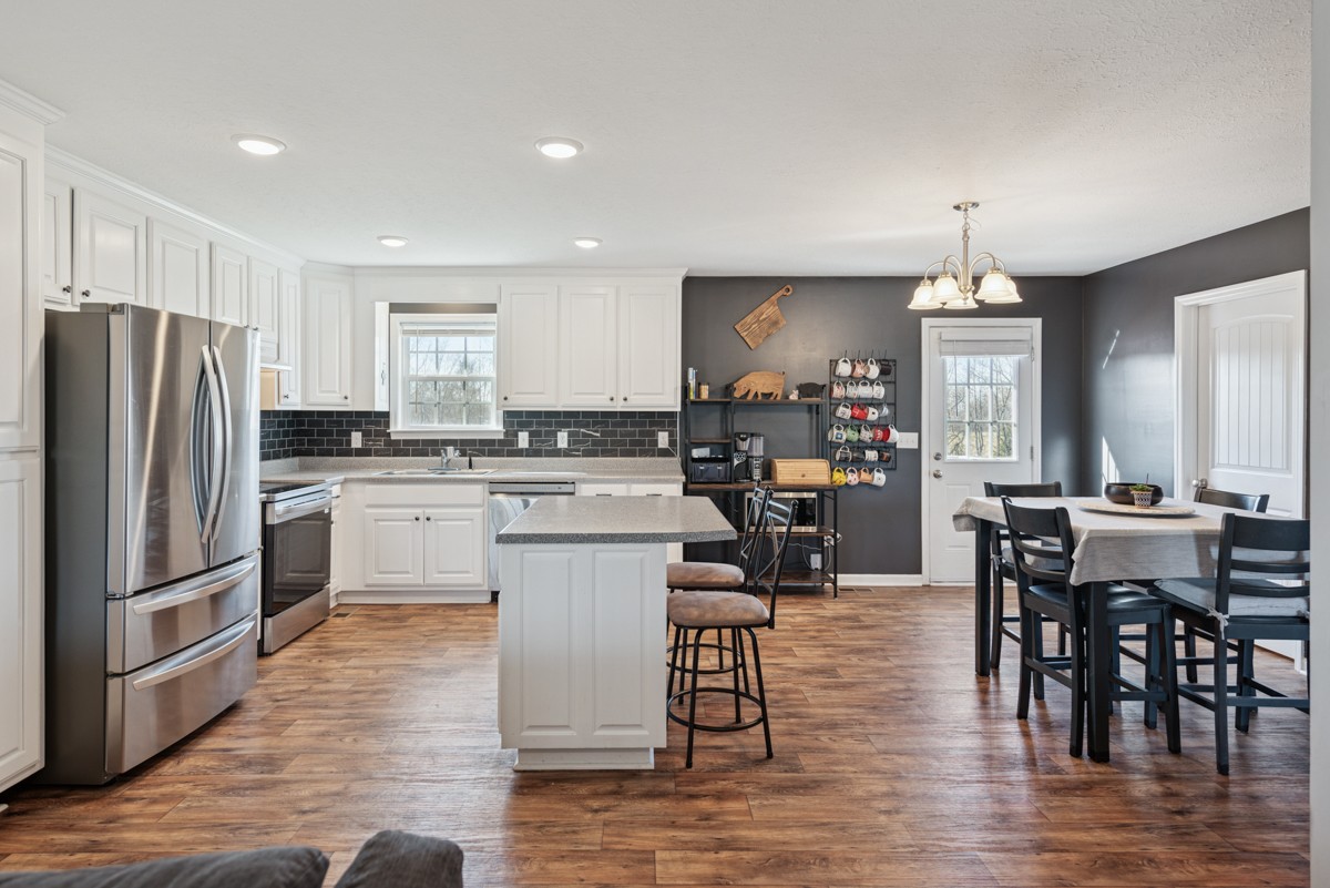 4915 Little Dry Creek Road Pulaski, TN 38478 - Photo 9 of 45 a kitchen with a refrigerator a counter top space cabinets and stainless steel appliances