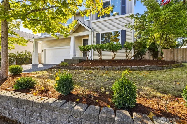 a front view of a house with garden