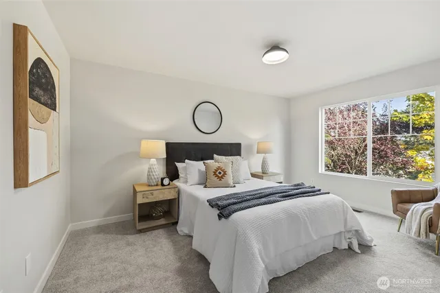 a bedroom with a bed and window