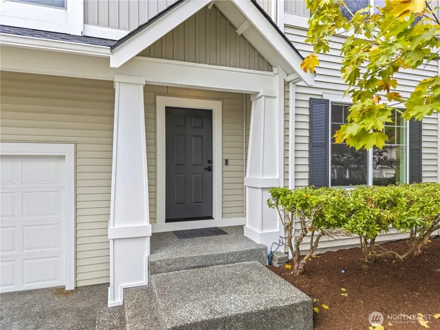 a front view of a house with garden