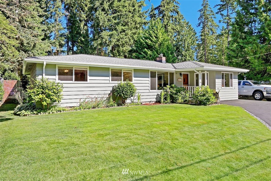 24217 4th Place West Bothell, WA 98021 - Photo 1 of 19 a front view of house with yard and green space