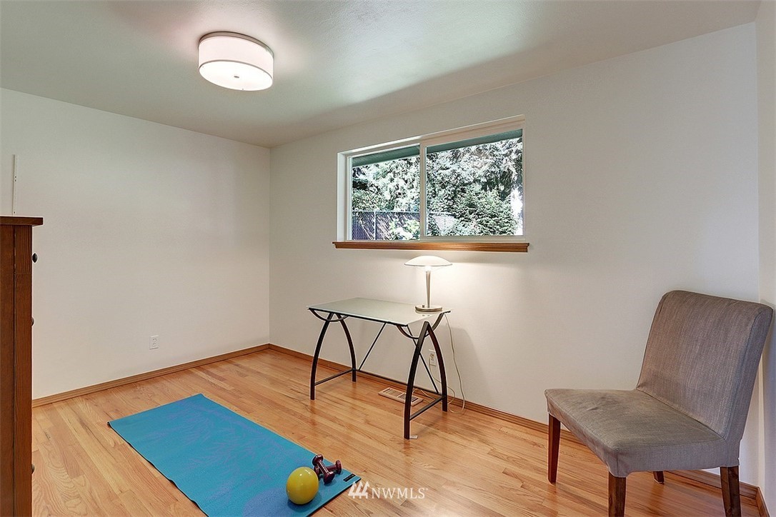 24217 4th Place West Bothell, WA 98021 - Photo 13 of 19 a view of a workspace with furniture and wooden floor
