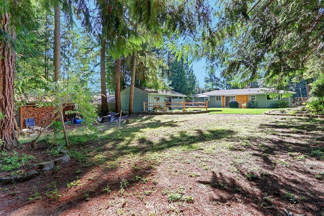24217 4th Place West Bothell, WA 98021 - Photo 16 of 19 a view of a house with a yard and sitting area
