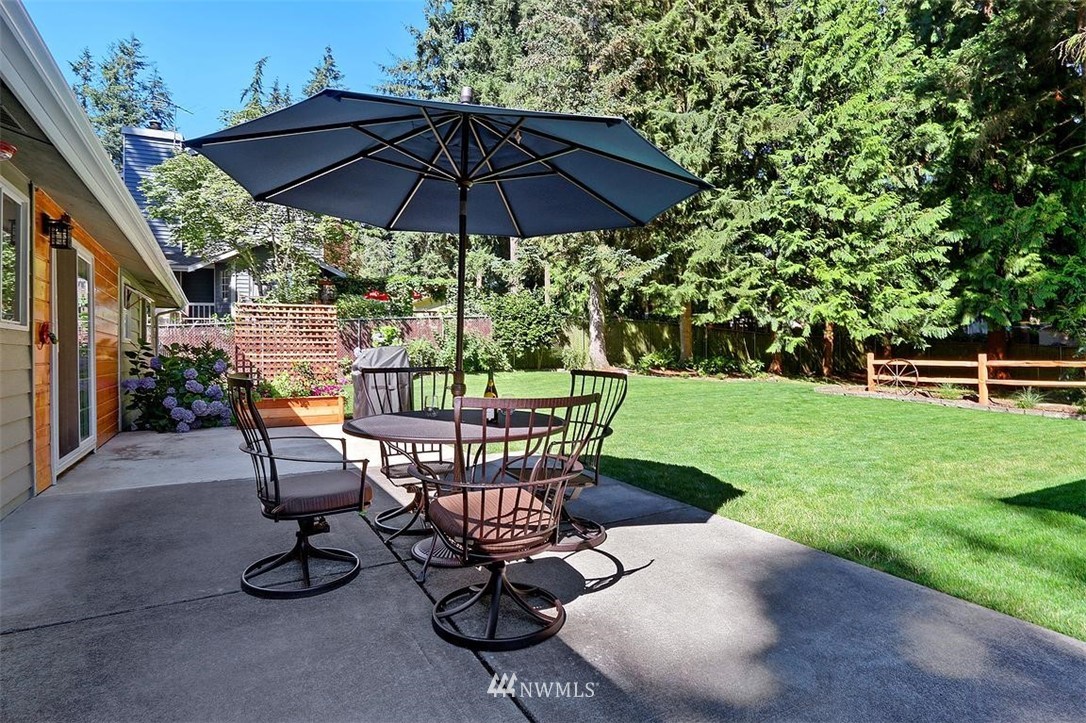 24217 4th Place West Bothell, WA 98021 - Photo 18 of 19 a view of backyard with seating space and trees