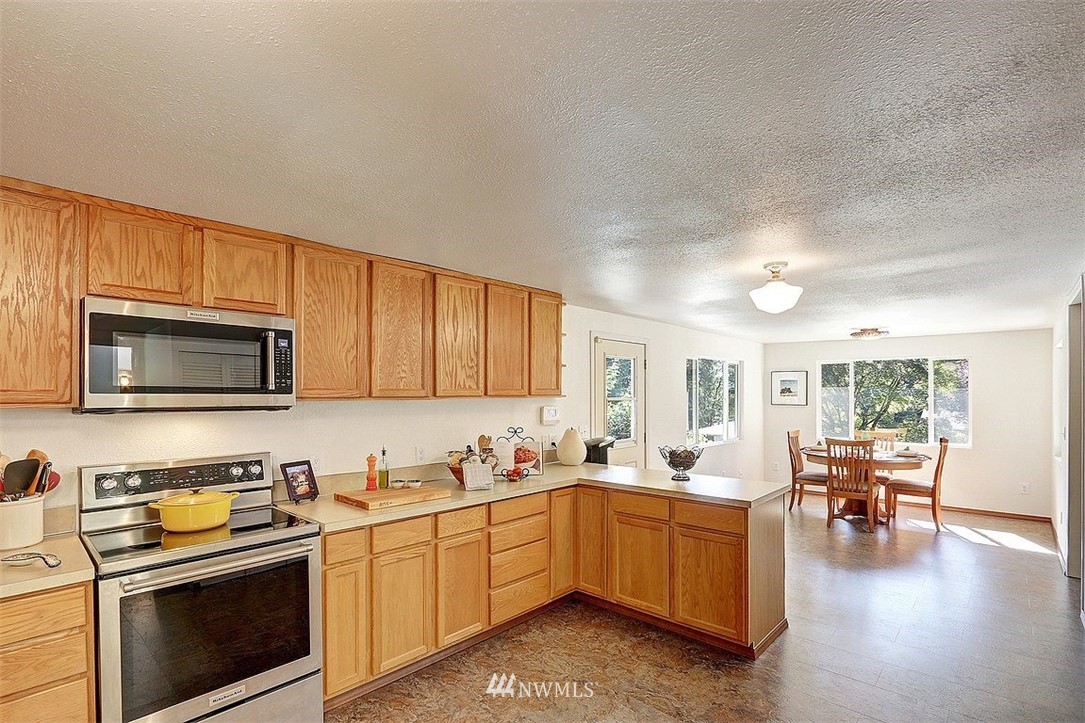 24217 4th Place West Bothell, WA 98021 - Photo 3 of 19 a kitchen with sink cabinets and microwave