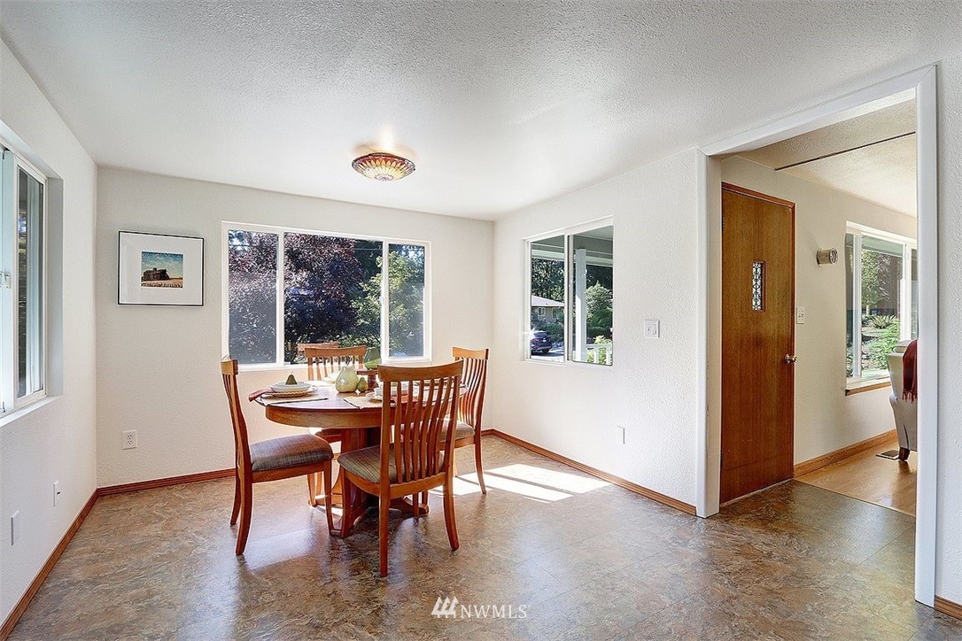 24217 4th Place West Bothell, WA 98021 - Photo 5 of 19 a view of a dining room with furniture window and wooden floor